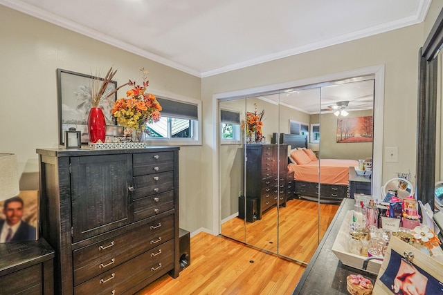 263 Claywood Dr, Brentwood, NY 11717 - bedroom featuring ornamental molding, light wood-style floors, a closet, and baseboards