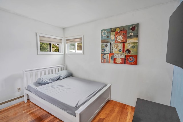 263 Claywood Dr, Brentwood, NY 11717 - bedroom featuring light wood-style floors and baseboards