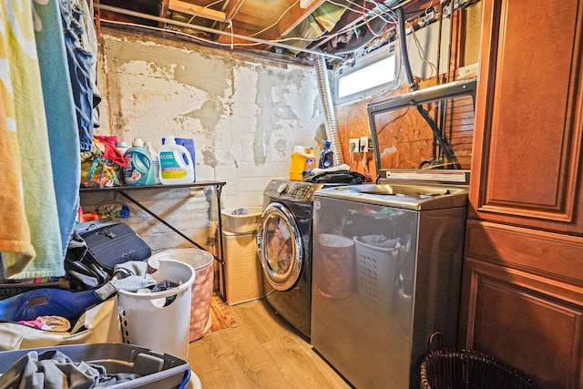 263 Claywood Dr, Brentwood, NY 11717 - laundry room featuring washing machine and clothes dryer and light wood-style floors
