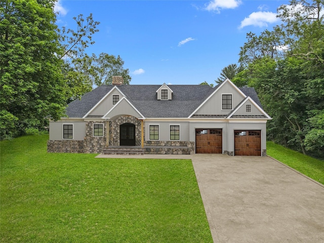 4 Circle Dr, Mount Kisco, NY 10549 - view of front of house with stone siding, driveway, a chimney, a front yard, and board and batten siding