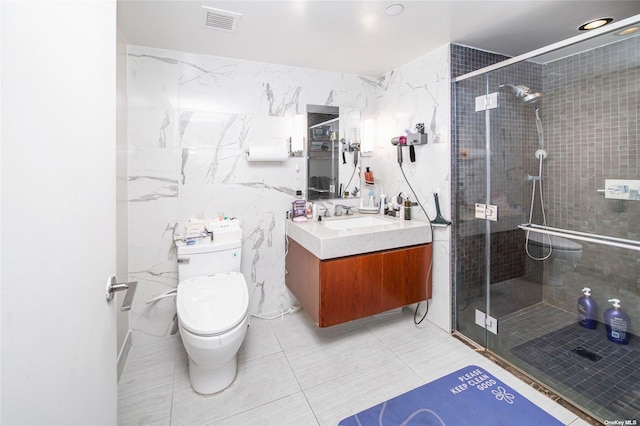 138-35 39th Ave Unit 16K, Flushing, NY 11354 - full bath with toilet, vanity, a shower stall, tile walls, and tile patterned floors