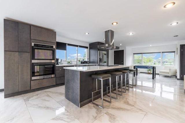 200LOTA Clocks Blvd, Massapequa, NY 11758 - kitchen with stainless steel appliances, island exhaust hood, plenty of natural light, modern cabinets, and recessed lighting