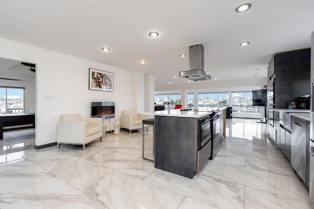 200LOTA Clocks Blvd, Massapequa, NY 11758 - kitchen featuring island range hood, healthy amount of natural light, light countertops, open floor plan, and recessed lighting