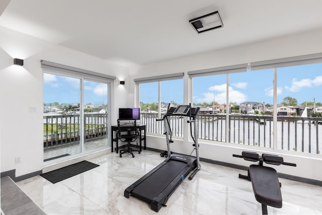 200LOTA Clocks Blvd, Massapequa, NY 11758 - exercise room featuring marble tiled floors and baseboards