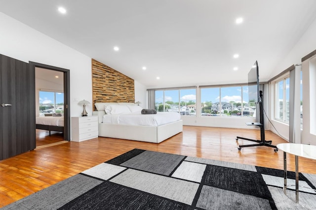 200LOTA Clocks Blvd, Massapequa, NY 11758 - bedroom featuring wood finished floors, multiple windows, recessed lighting, and high vaulted ceiling