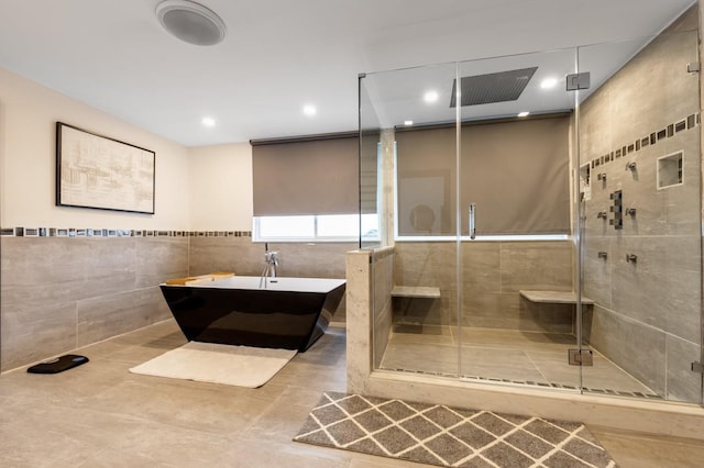 200LOTA Clocks Blvd, Massapequa, NY 11758 - bathroom featuring tile walls, a freestanding tub, a shower stall, and recessed lighting