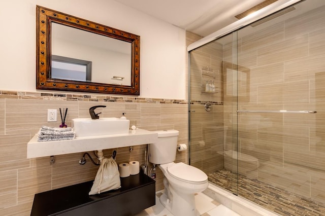 200LOTA Clocks Blvd, Massapequa, NY 11758 - full bath featuring a sink, toilet, a shower stall, tile walls, and a wainscoted wall