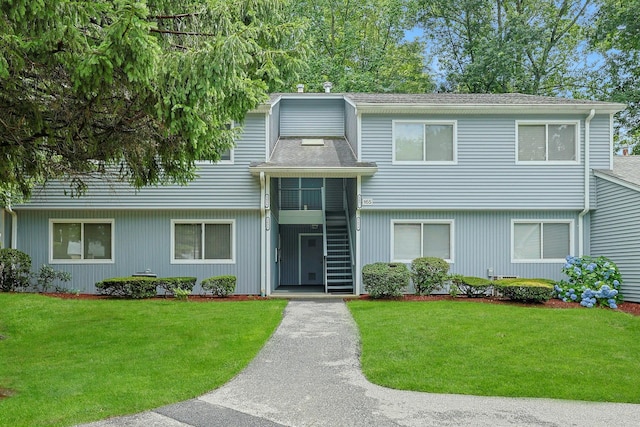 165 Carriage Ct Unit H, Yorktown Heights, NY 10598 - view of front of house featuring a front lawn, stairs, and roof with shingles