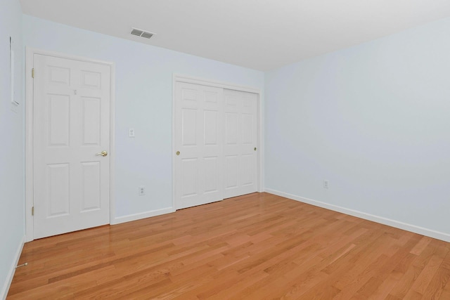 165 Carriage Ct Unit H, Yorktown Heights, NY 10598 - unfurnished bedroom with light wood-style floors and a closet