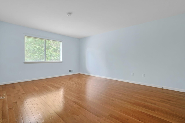 165 Carriage Ct Unit H, Yorktown Heights, NY 10598 - spare room with light wood-type flooring and a smoke detector