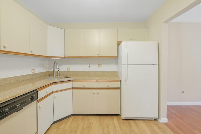 165 Carriage Ct Unit H, Yorktown Heights, NY 10598 - kitchen with white appliances, light wood-style flooring, light countertops, and cream cabinetry