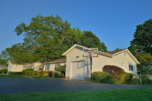 238 Adams St, Deer Park, NY 11729 - view of property exterior featuring a garage and driveway