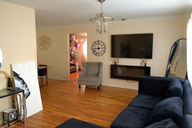 238 Adams St, Deer Park, NY 11729 - living room featuring wood finished floors, a chandelier, and crown molding