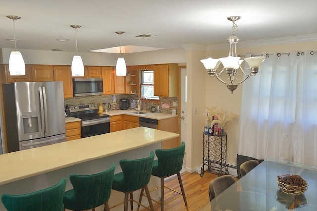 238 Adams St, Deer Park, NY 11729 - kitchen featuring stainless steel appliances, light countertops, light wood finished floors, tasteful backsplash, and a breakfast bar area