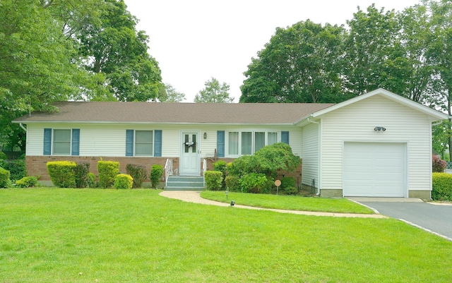 238 Adams St, Deer Park, NY 11729 - single story home with an attached garage, a front lawn, asphalt driveway, and brick siding