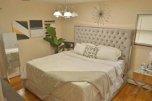 238 Adams St, Deer Park, NY 11729 - bedroom with wood finished floors and a chandelier