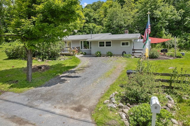 10 Hy Vue Ter, Cold Spring, NY 10516 - view of front of home featuring driveway, a chimney, a front lawn, and a porch