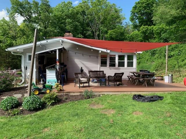 10 Hy Vue Ter, Cold Spring, NY 10516 - back of property with a deck, a lawn, and an outdoor living space