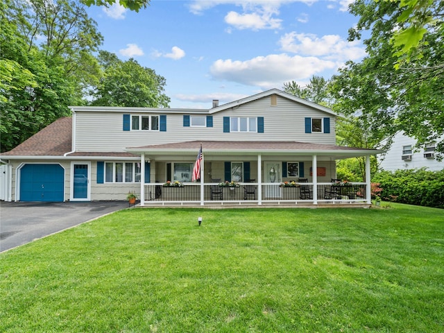 32 Sterling Dr, Lake Grove, NY 11755 - view of front of home with a porch, an attached garage, driveway, and a front lawn