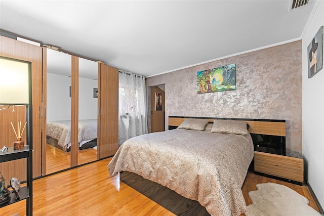 32 Henry Pl, Staten Island, NY 10305 - bedroom with wood finished floors and a fireplace
