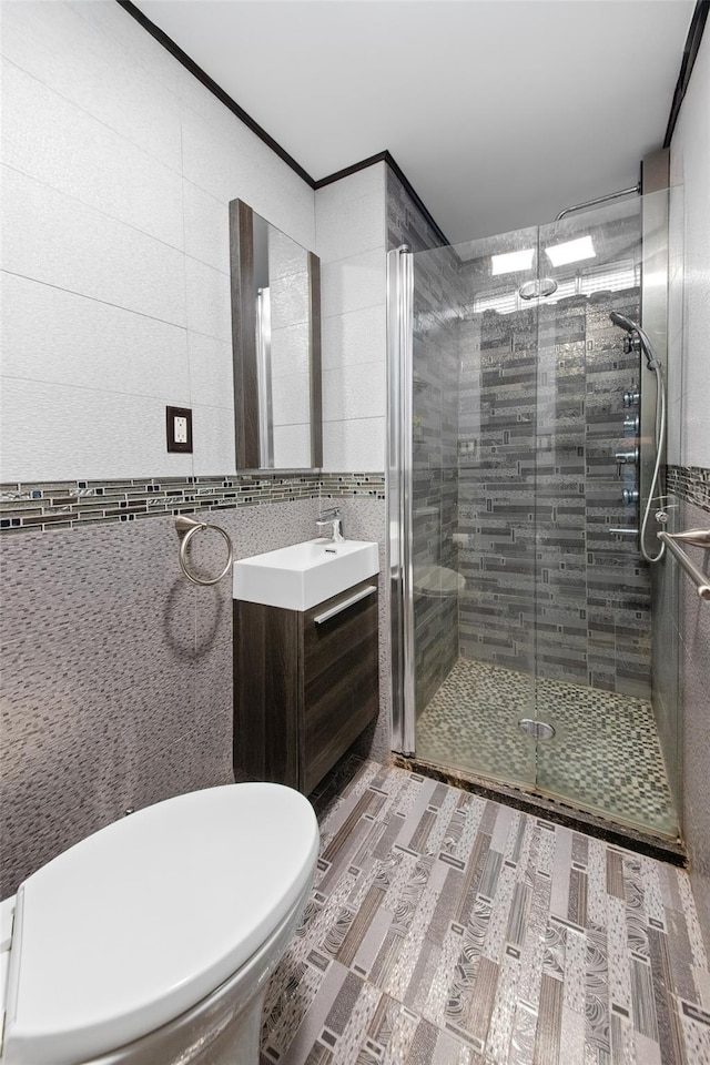 32 Henry Pl, Staten Island, NY 10305 - bathroom featuring tile walls, vanity, a shower stall, and toilet