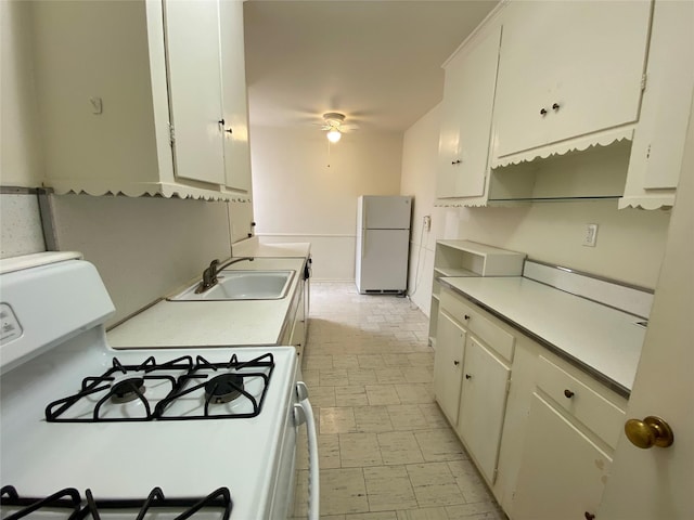501 Riverdale Ave Unit 6L, Yonkers, NY 10705 - kitchen featuring white appliances, a sink, light countertops, a ceiling fan, and white cabinets