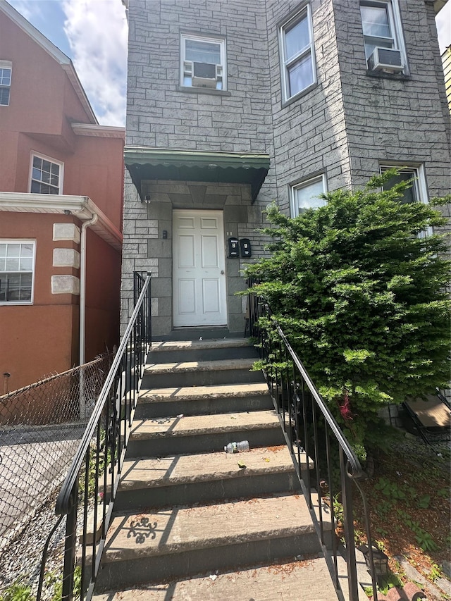 148 S 13th Ave, Mount Vernon, NY 10550 - view of exterior entry with stone siding and cooling unit