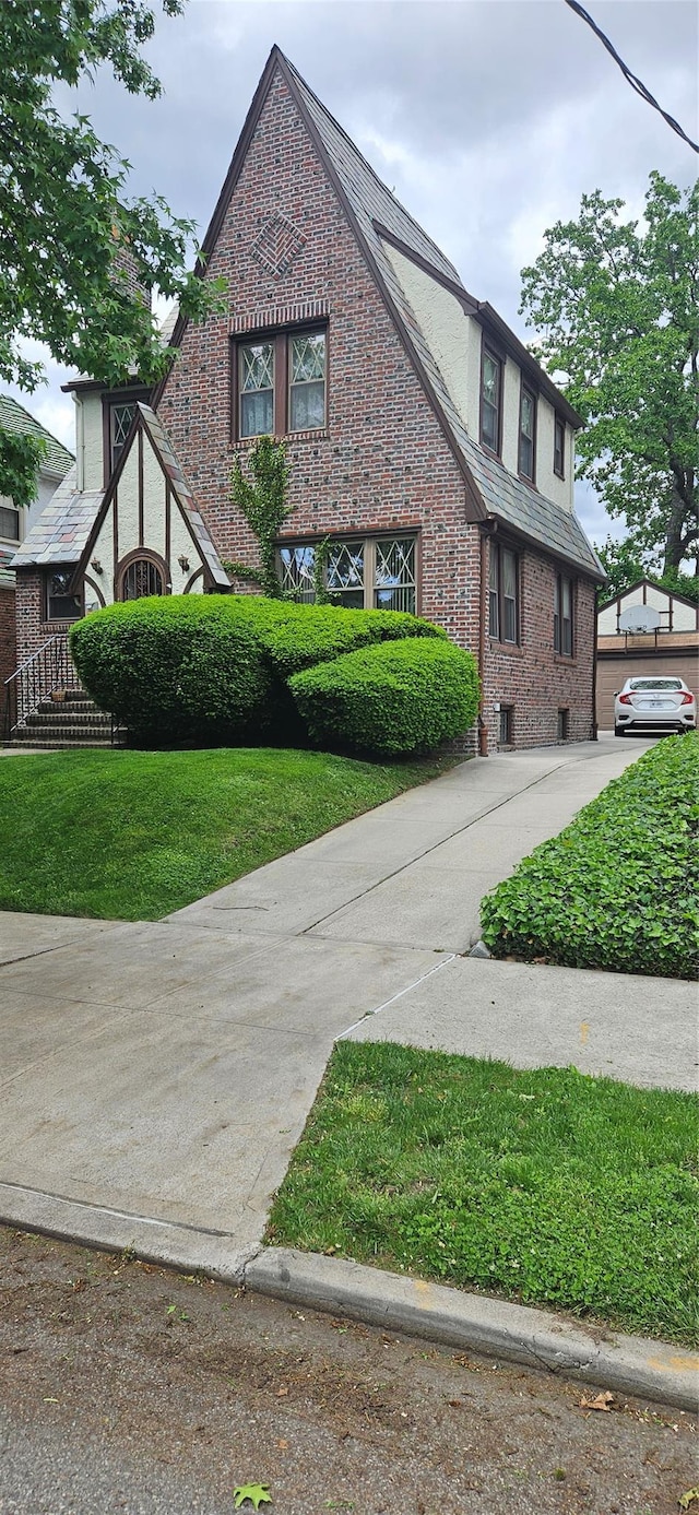 16023 28th Ave, Flushing, NY 11358 - view of property exterior with brick siding and driveway