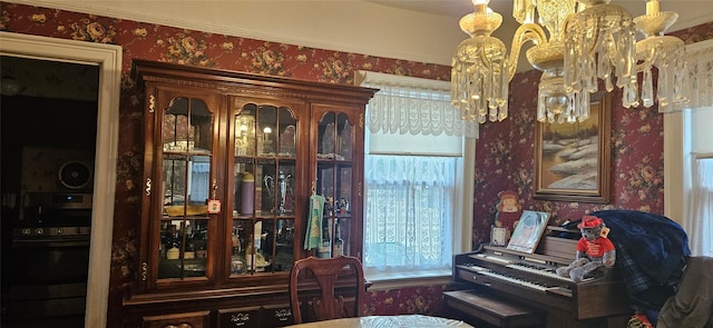 16023 28th Ave, Flushing, NY 11358 - sitting room with a chandelier, wallpapered walls, and plenty of natural light
