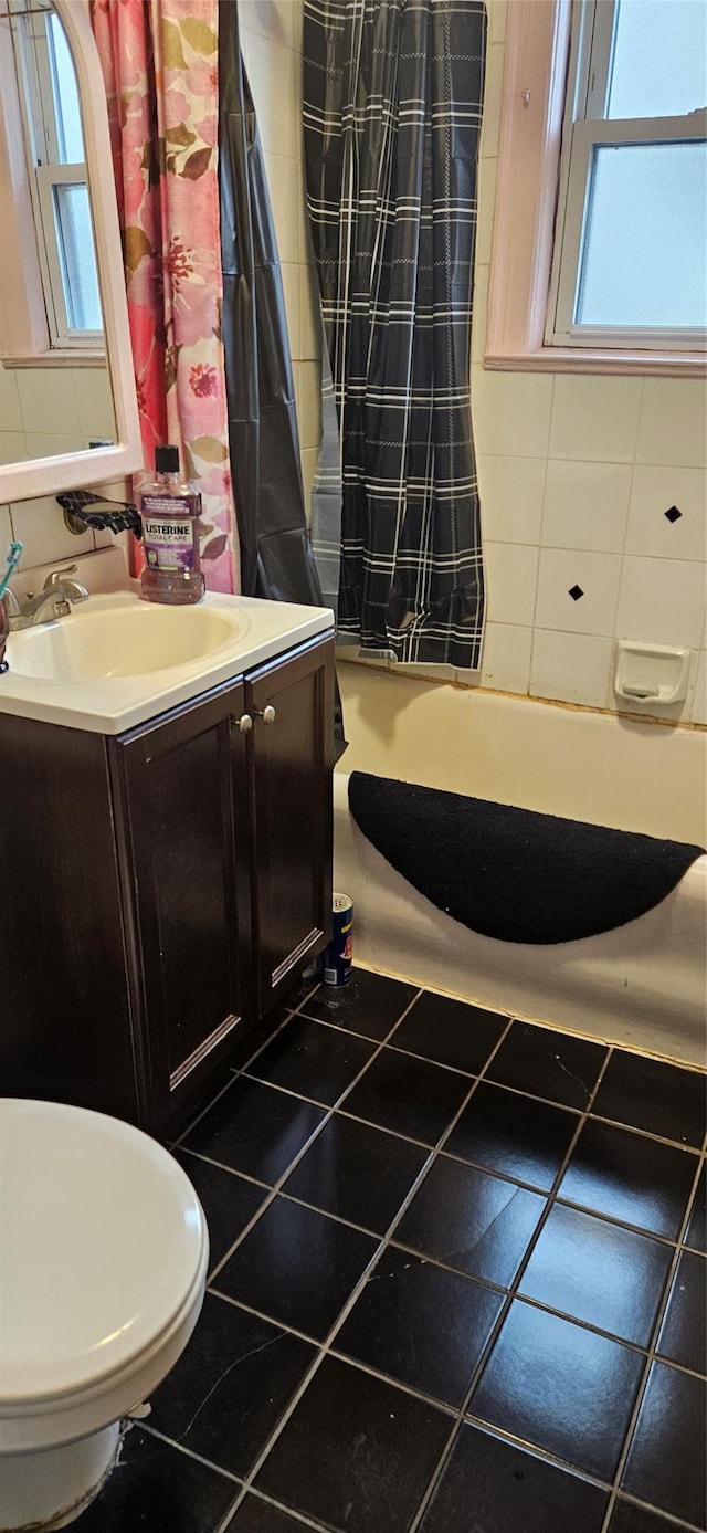 16023 28th Ave, Flushing, NY 11358 - bathroom featuring toilet, vanity, tile patterned floors, and curtained shower