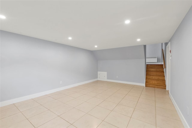 27 Meadowfield Ln, Glen Cove, NY 11542 - empty room with recessed lighting, radiator, stairway, lofted ceiling, and light tile patterned floors