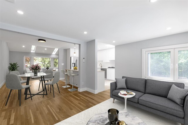 27 Meadowfield Ln, Glen Cove, NY 11542 - living room featuring light wood-style floors and recessed lighting