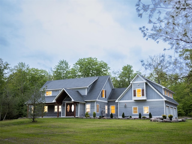 123 Wildwood Way, Forestburgh, NY 12777 - view of front facade featuring a front lawn, board and batten siding, and roof with shingles