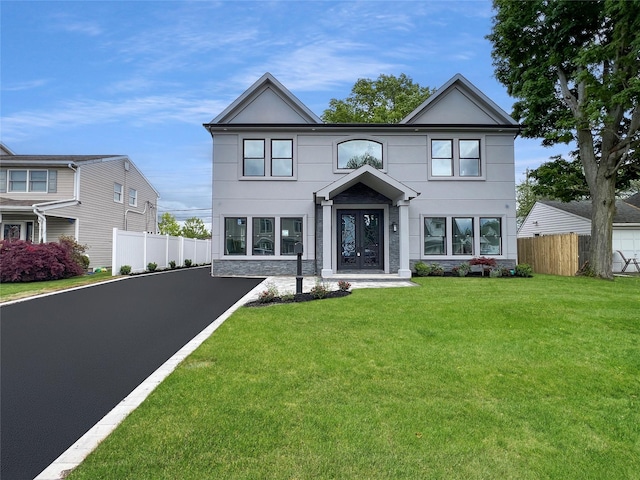 229 Blueberry Ln, Hicksville, NY 11801 - view of front facade featuring stucco siding, french doors, and driveway
