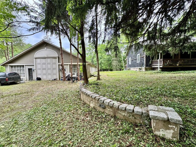 210A Seven Bridges Rd, Mount Kisco, NY 10549 - view of yard featuring a wooden deck and a garage