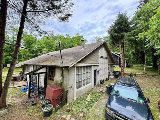 210A Seven Bridges Rd, Mount Kisco, NY 10549 - view of side of home with roof with shingles and stucco siding