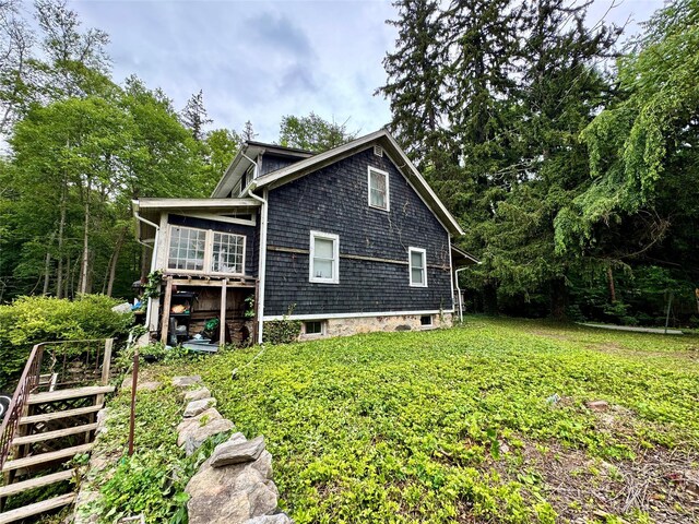 210A Seven Bridges Rd, Mount Kisco, NY 10549 - view of home's exterior with a sunroom and a yard