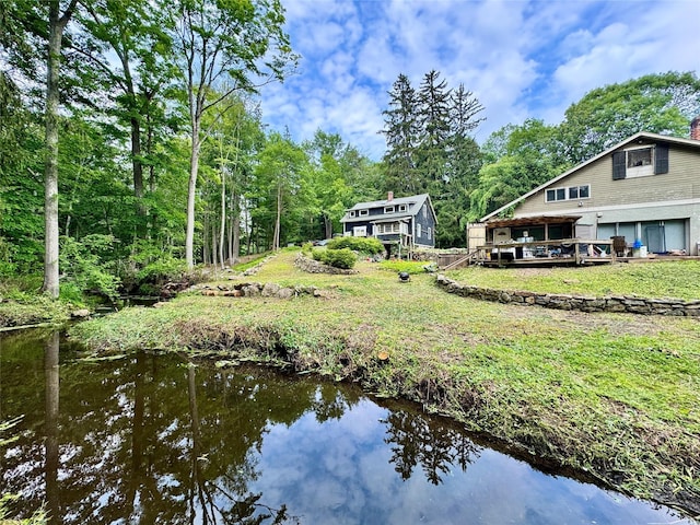 210A Seven Bridges Rd, Mount Kisco, NY 10549 - view of green lawn with a deck with water view
