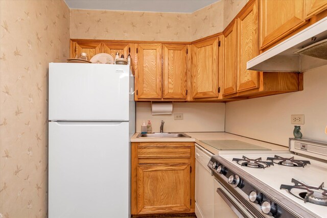 23-45 Bell Blvd Unit 4K, Bayside, NY 11360 - kitchen with white appliances, wallpapered walls, under cabinet range hood, a sink, and light countertops