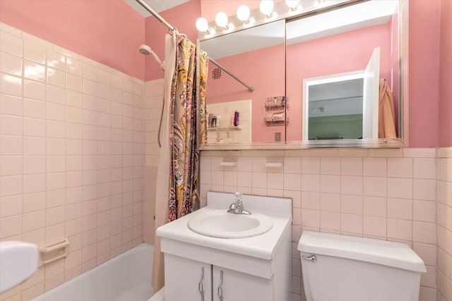 23-45 Bell Blvd Unit 4K, Bayside, NY 11360 - bathroom featuring shower / bath combination with curtain, vanity, toilet, and tile walls