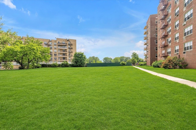 23-45 Bell Blvd Unit 4K, Bayside, NY 11360 - view of community with a lawn