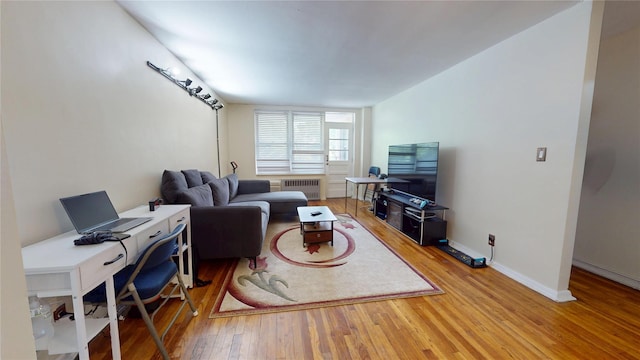 142-20 84th Dr Unit 3K, Briarwood, NY 11435 - living room featuring radiator heating unit and wood finished floors