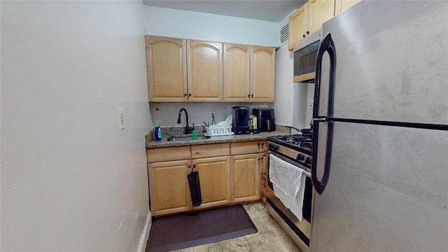 142-20 84th Dr Unit 3K, Briarwood, NY 11435 - kitchen with appliances with stainless steel finishes, light brown cabinets, and light stone countertops