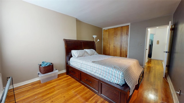 142-20 84th Dr Unit 3K, Briarwood, NY 11435 - bedroom featuring light wood finished floors and a closet