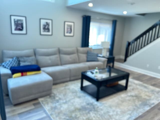 38 Tulip Ct, Nanuet, NY 10954 - living area featuring wood finished floors, stairway, and baseboards