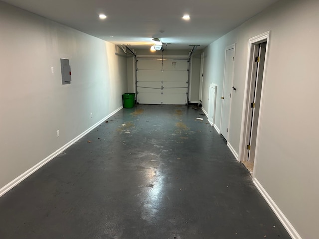 38 Tulip Ct, Nanuet, NY 10954 - garage featuring baseboards, electric panel, recessed lighting, and a garage door opener