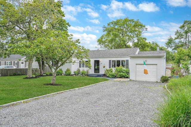 215 Lyman Rd, East Patchogue, NY 11772 - ranch-style house with an attached garage, gravel driveway, and roof with shingles