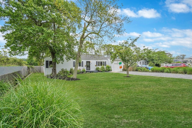 215 Lyman Rd, East Patchogue, NY 11772 - view of front facade with driveway and a garage