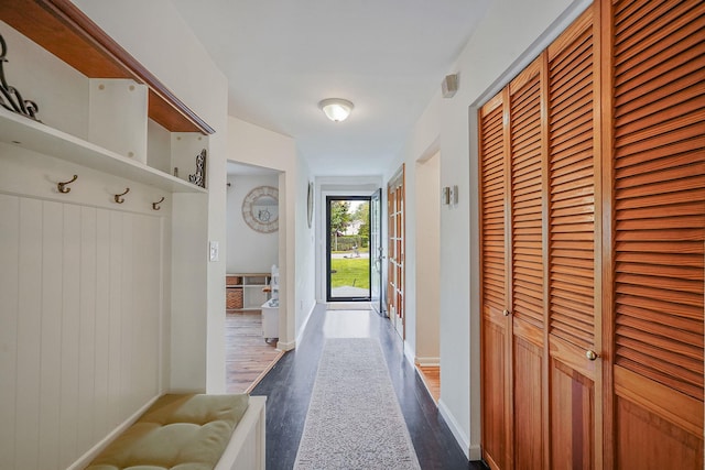 215 Lyman Rd, East Patchogue, NY 11772 - hall with dark wood-type flooring and baseboards