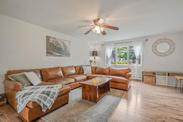215 Lyman Rd, East Patchogue, NY 11772 - living area with a ceiling fan and light wood finished floors
